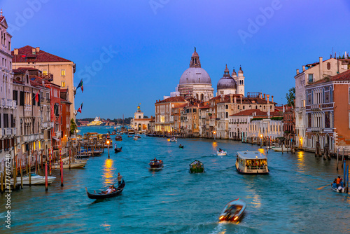 Basilica of Santa Maria della Salute and Grand Canal in Venice at night, Italy