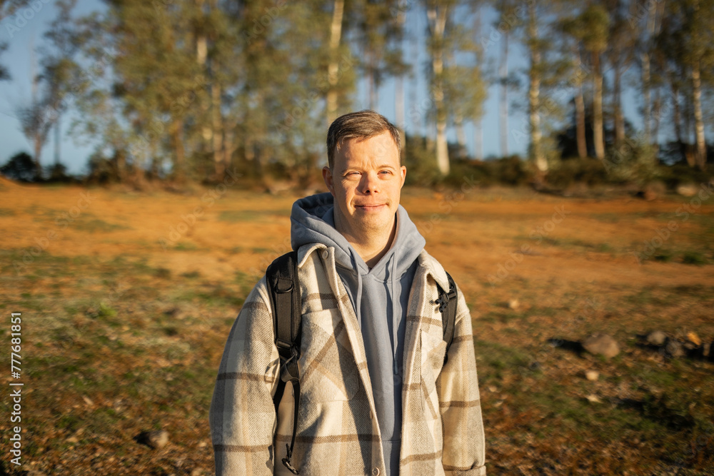 man with down syndrome walking in nature man with down syndrome walking in nature