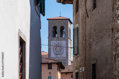 Stroll along narrow urban street that meanders towards magnificent Cathedral of Santa Maria Assunta. Old town of charming town of Cividale del Friuli, Udine province, Friuli Venezia Giulia, Italy photo