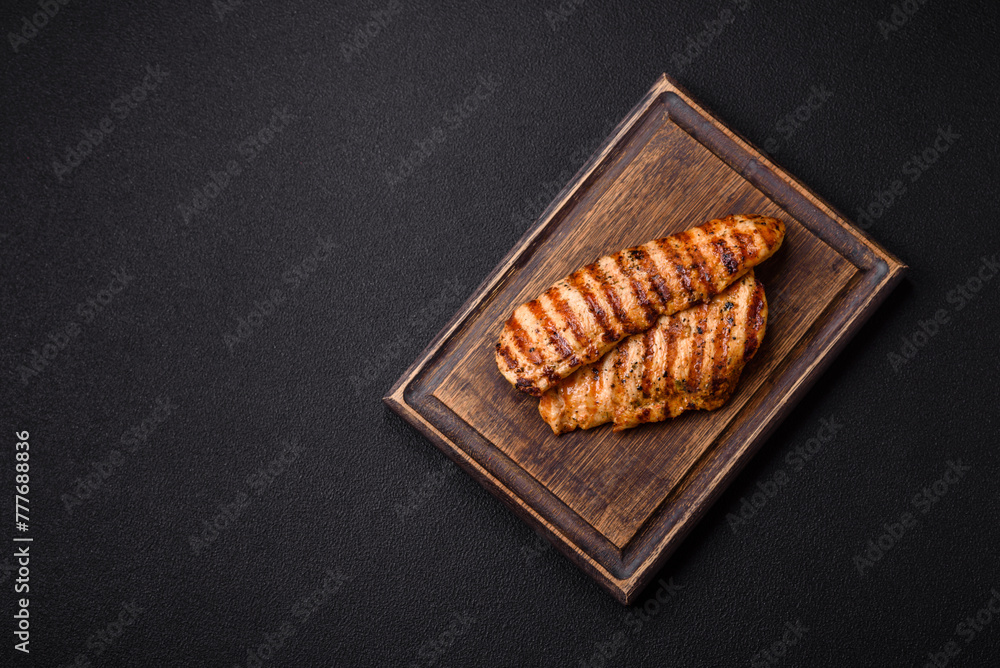 Delicious fresh grilled chicken fillet with spices and herbs Delicious fresh grilled chicken fillet with spices and herbs