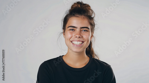 Joyful Young Woman with a Lively Smile and Casual Black Tee on White Background