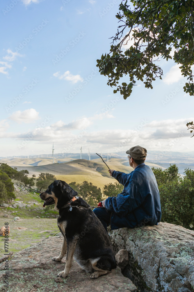 Older asian man with dog outside Older asian man with dog outside