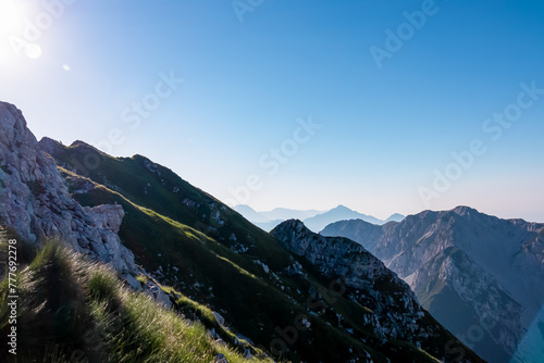 Scenic view of mountain peak Storzic in majestic Kamnik-Savinja Alps, Slovenia, Europe. Magnificent Hiking trail on Loibl Pass in untamed Karawanks, Austrian border. Magical mountains Slovenian Alps