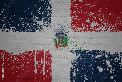 painted big national flag of dominican republic on a massive old brick wall