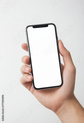 Close-up, a hand holding a mobile phone at white screen , white background