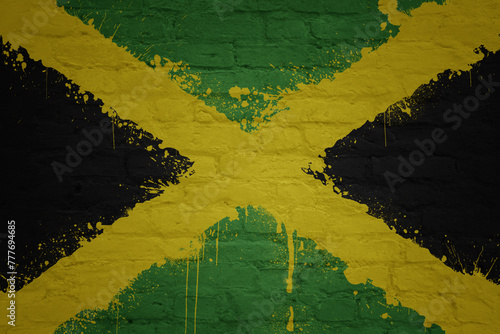 painted big national flag of jamaica on a massive old brick wall