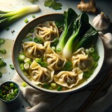 Wonton soup.
Delicate wonton dumplings, filled with a savory blend of pork and spices in a fragrant broth infused with ginger, garlic, and green onions, topped with crisp bok choy.