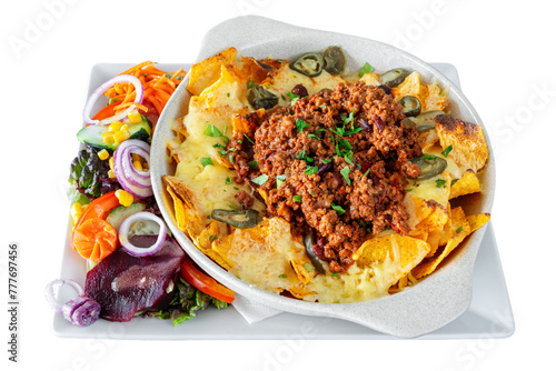 Mexican corn and vegetable salad with cheese and nachos chips in a white dish. Mexican food concept. On a white isolated background.