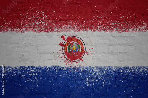 painted big national flag of paraguay on a massive old brick wall