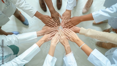 A circle of healing hands: An aerial view capturing a multiethnic medical team's hands together, forming a circle of unity and shared purpose