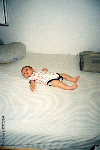 BABY ON A BED photo
