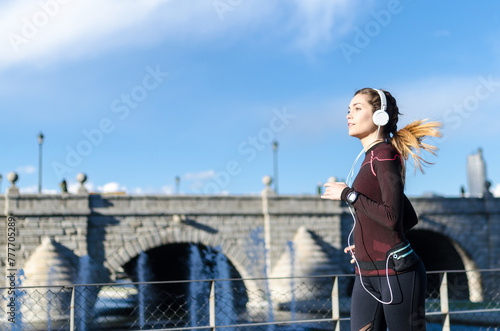 woman stretching resting after running and jogging in a park with sportswear