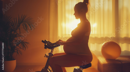 Obraz na płótnie Silhouette of a pregnant woman cycling on indoor bike. w salonie