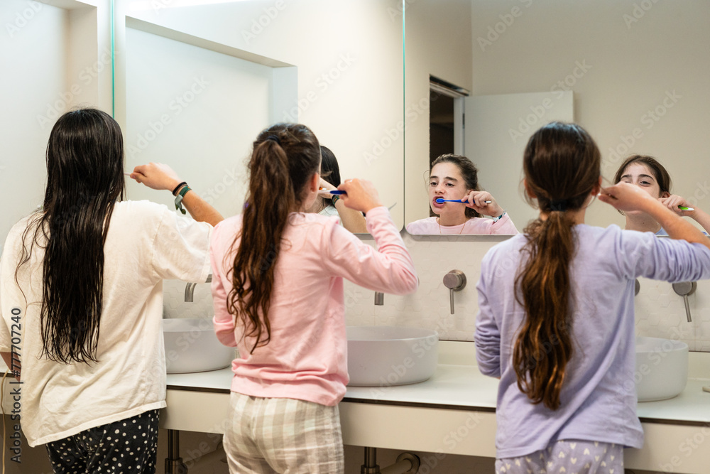 sisters kids girls brushing teeth before bedtime sisters kids girls brushing teeth before bedtime