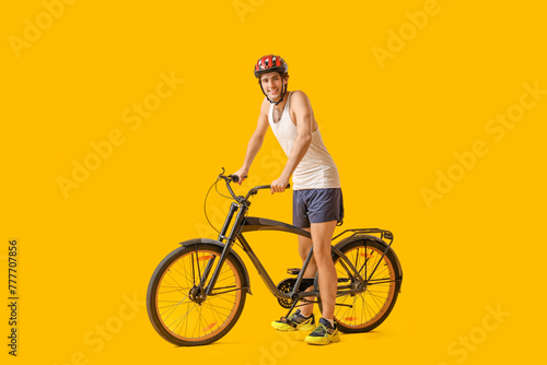 Young male cyclist with bic...
