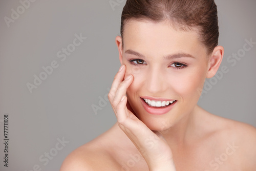 Skincare  makeup and portrait of woman in studio for dermatology  wellness or facial treatment with gray background. Beauty  smile and female model for healthy skin  cosmetics or natural glow