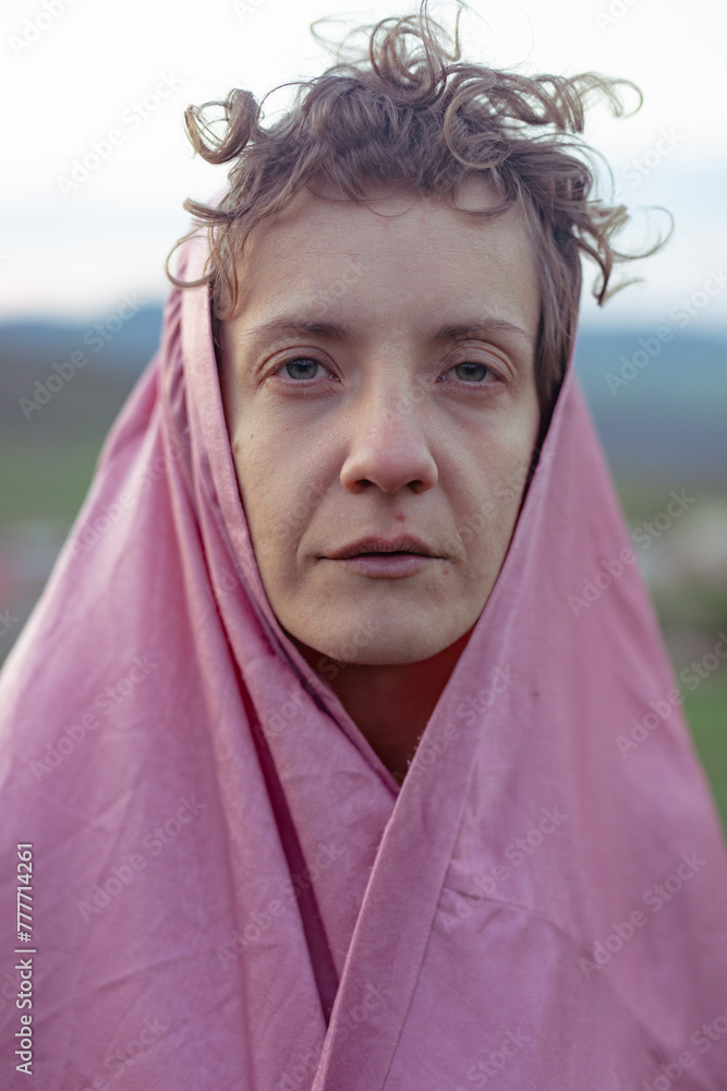 portrait of a beautiful blonde in a pink cape portrait of a beautiful blonde in a pink cape