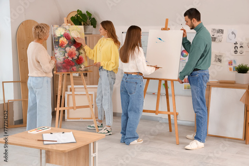 Adults learning painting in...