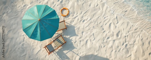 A relaxing beach scene with a single blue umbrella  a wooden chair  and a lifebuoy laid neatly on sandy beach texture  shadows indicating sunny weather