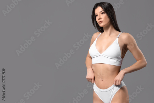 Pretty young woman in white...