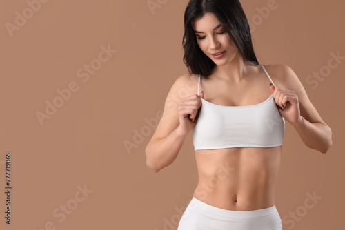 Pretty young woman in white...