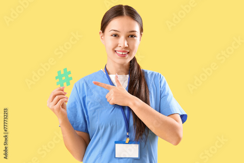 Young female doctor pointin...