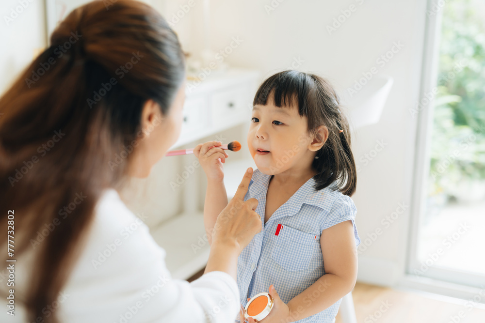 Cute baby is playing makeup makeup game with her mother Cute baby is playing makeup makeup game with her mother