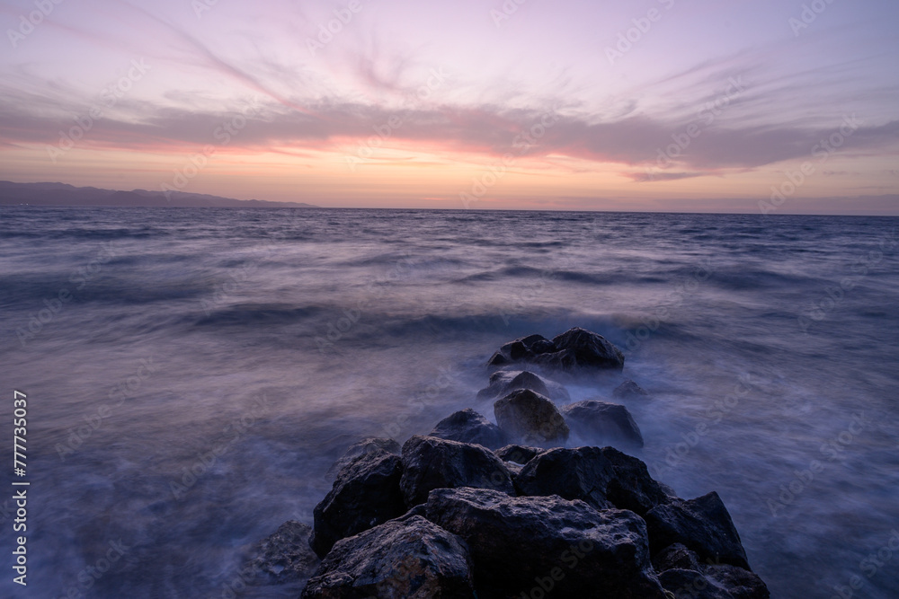 Fototapeta premium Sunset on Mediterranean Sea. Cloudy day.