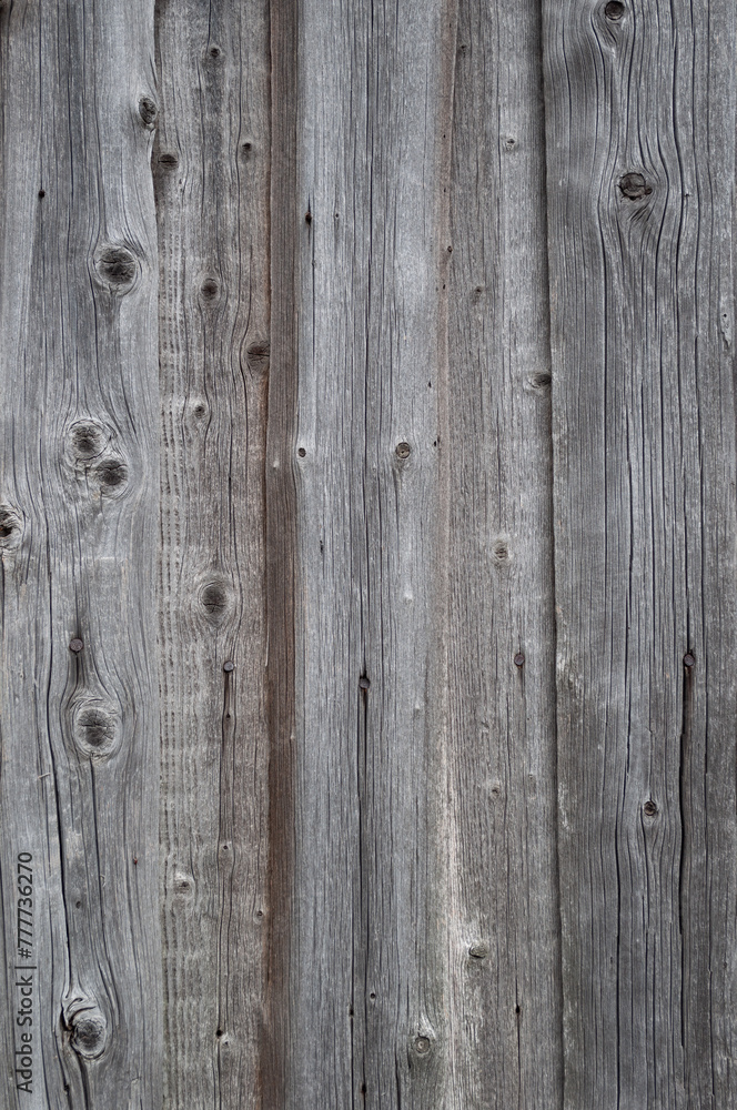 Texture of old country fence of weathered rough wooden boards Texture of old country fence of weathered rough wooden boards