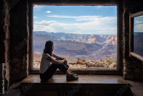 Woman gazing Grand Canyon photo