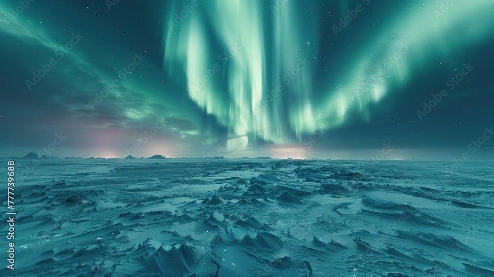 The northern lights cast a green glow over a vast, snowy tundra, creating a mesmerizing scene.
