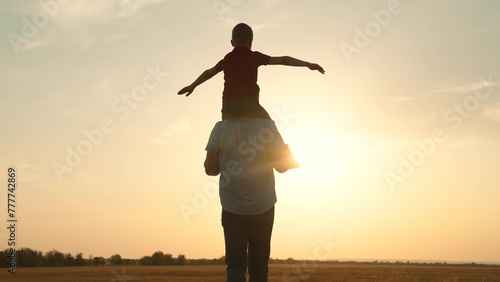 silhouette father carrying child boy his shoulders sunsethappy family, family outdoor activity, child piggyback father, bonding family silhouette., father and son play, childhood adventure piggyback photo