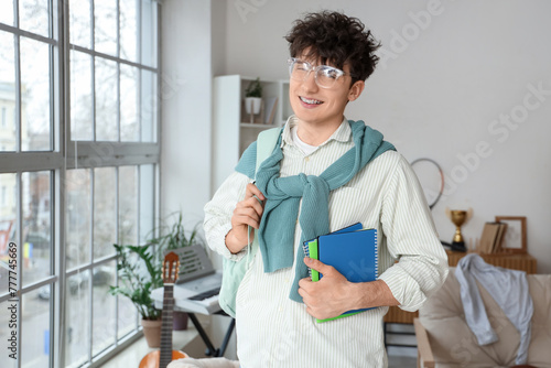 Male student with copybooks...