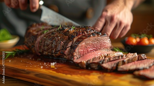 Chef slicing perfectly cooked steak on wooden board