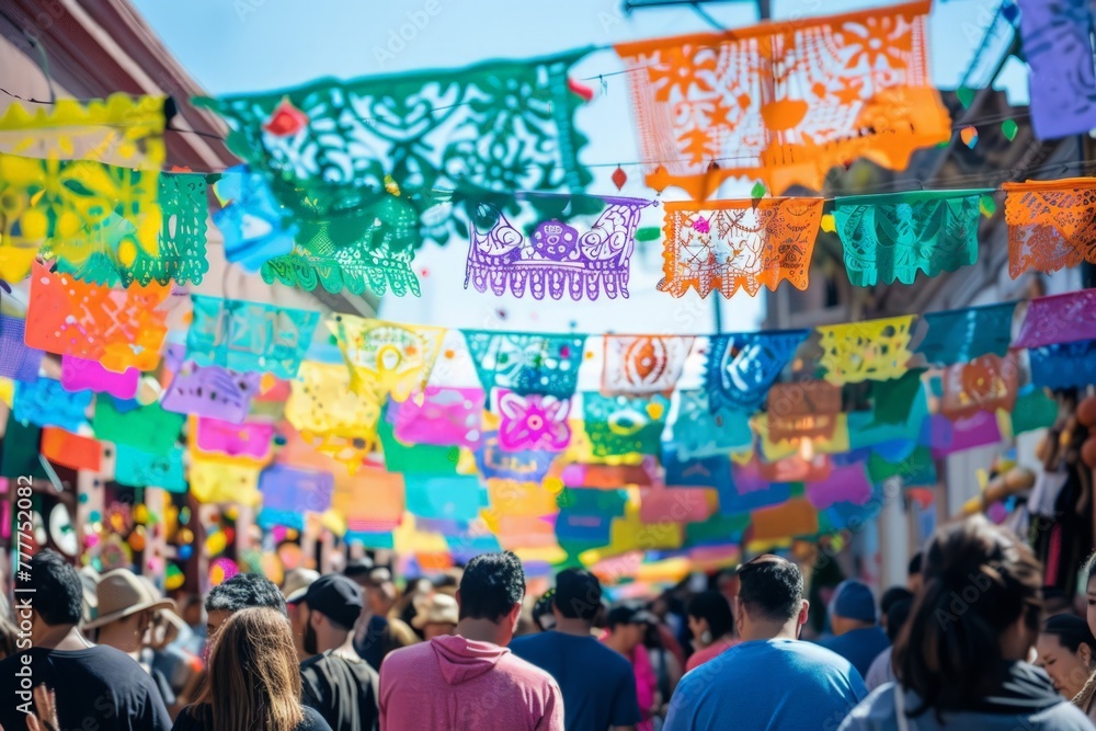 Fototapeta premium colorful Mexican paper flags hanging on the street