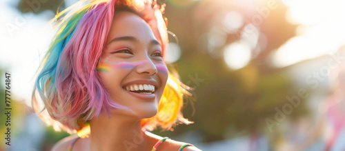 Portrait of happy asian woman with rainbow hair celebrating pride month. Gay lesbian female smiling at pride parade. Inclusion & diversity. Eccentric LGBTQ+ beauty, Copy space