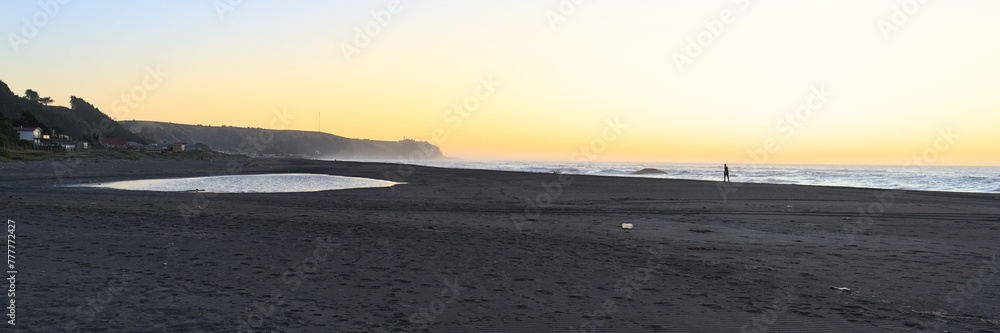 SDand beach at sunset (Iloca, Chile)