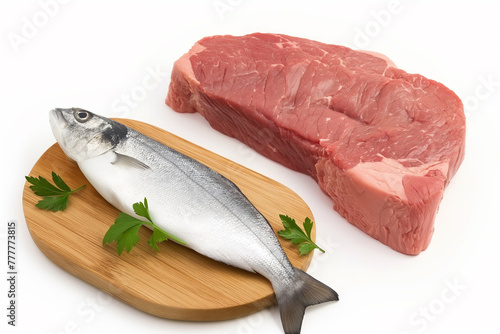 A fish and a piece of meat are on cutting boards