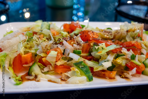 Green vegetables salad for turkish mixed grill meat, chicken wings, lamb, beef shashlik, kebab in restaurant