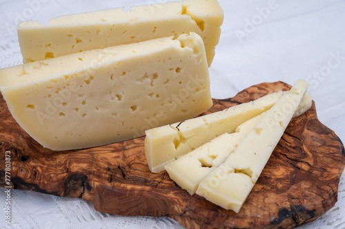 Fresh Asiago cow's milk cheese, from Asiago in Italy, used in panini or sandwiches or melted on variety of dishes, classified as a Swiss-type Alpine cheese