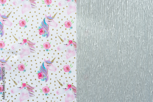 fabric with unicorn print pattern and metallic silver crepe paper