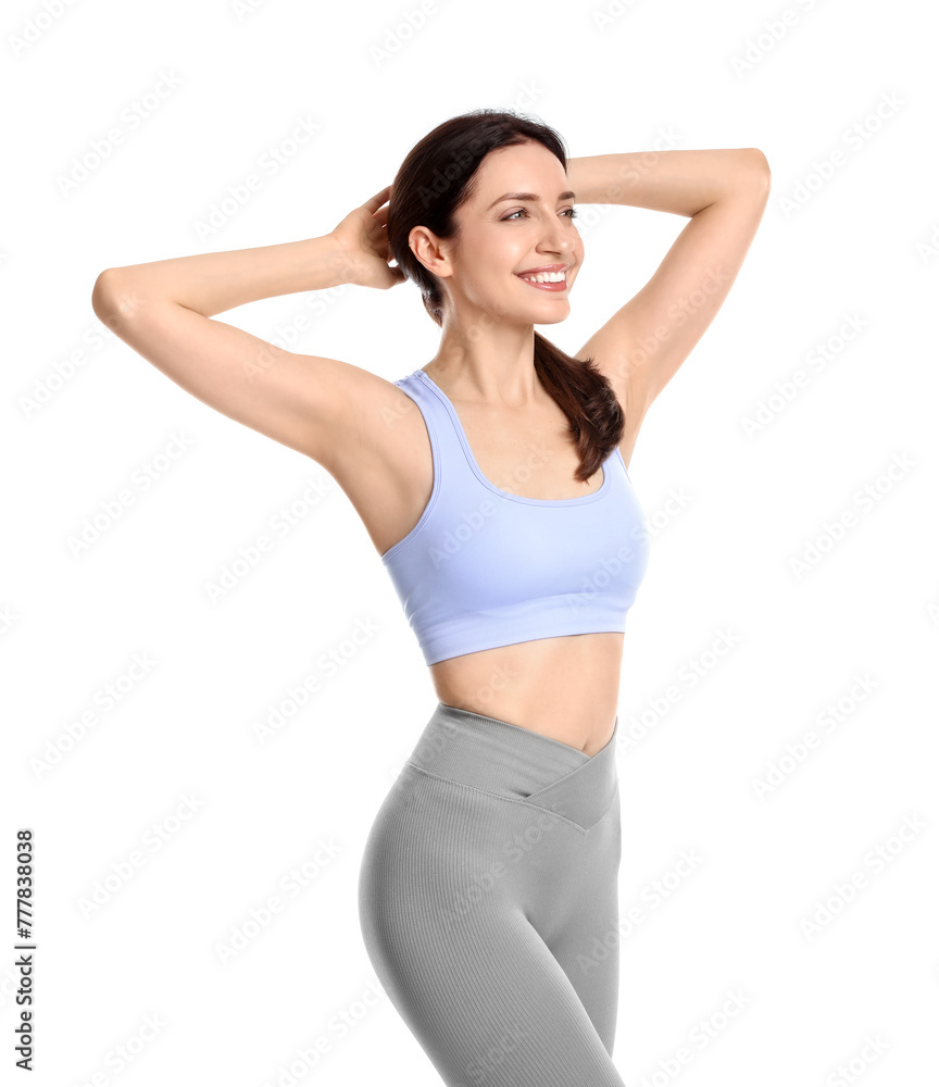 Happy young woman with slim body posing on white background