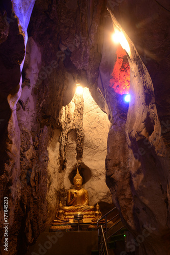 Buddha statues in various postures Enshrined in the famous Tham Khao Yoi Temple. And there are beautiful stalagmites and stalactites. Located at Petchaburi Province in Thailand.