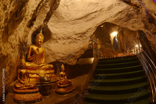 Buddha statues in various postures Enshrined in the famous Tham Khao Yoi Temple. And there are beautiful stalagmites and stalactites. Located at Petchaburi Province in Thailand.