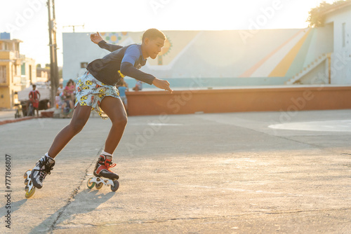 Black Hispanic Boy Roller Skating Outdoors.