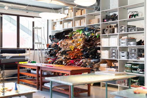 Interior of recycled leather fashion workplace with supplies photo