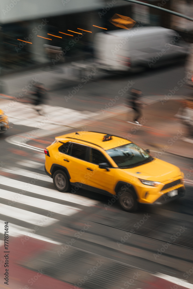 yellow blurred cab in the streets of NYC yellow blurred cab in the streets of NYC