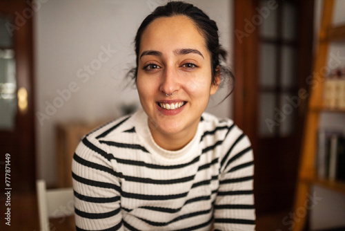 portrait of young woman at home photo