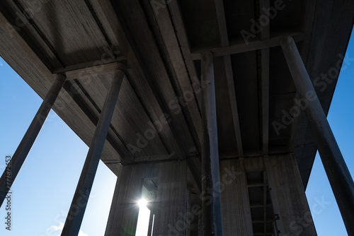Under a concrete bridge photo