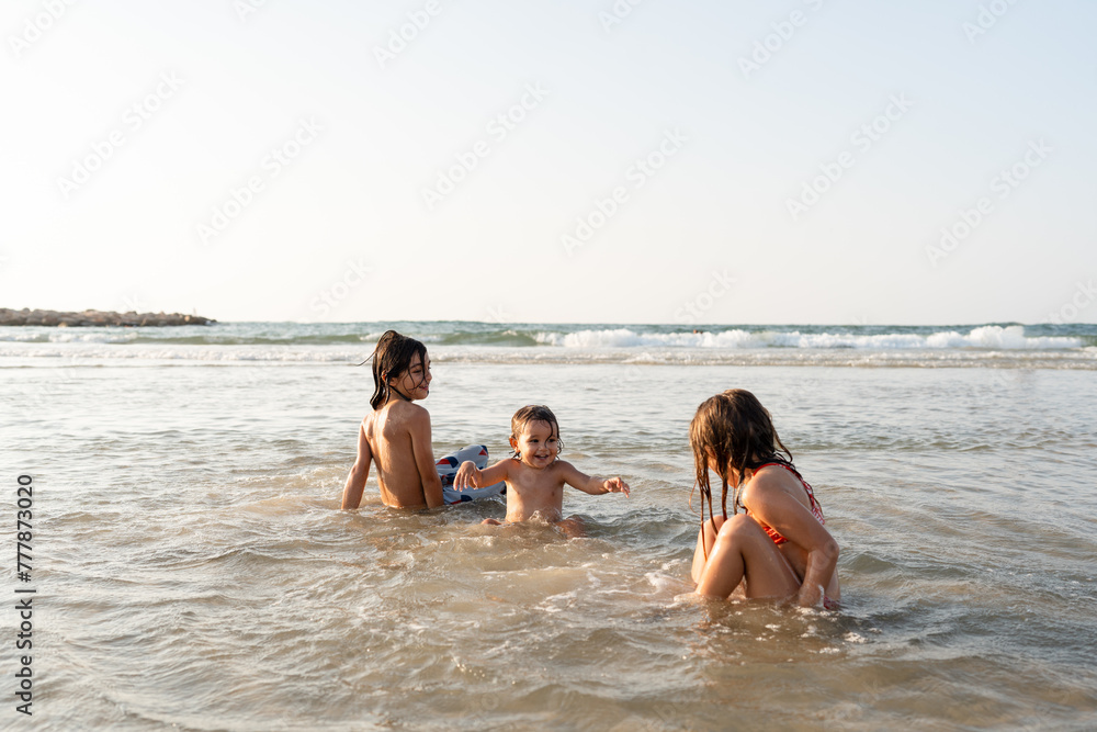 Siblings jumping in the water Siblings jumping in the water